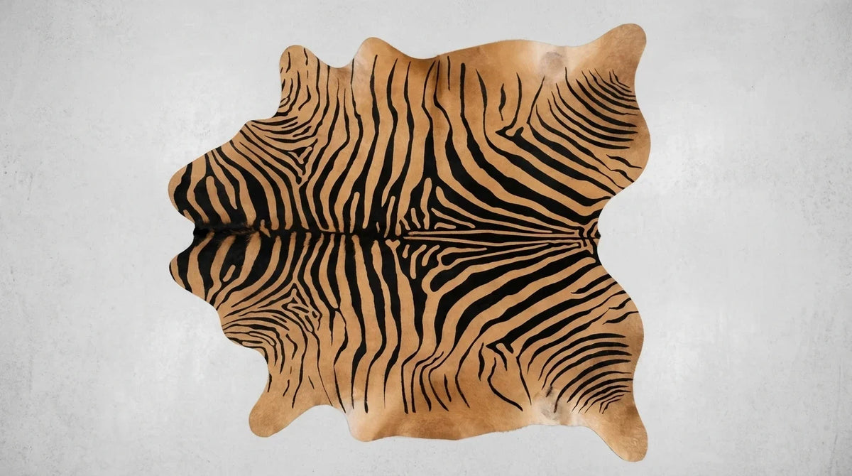 Black and White cowhide rug flat lay on white background showing full hide shape