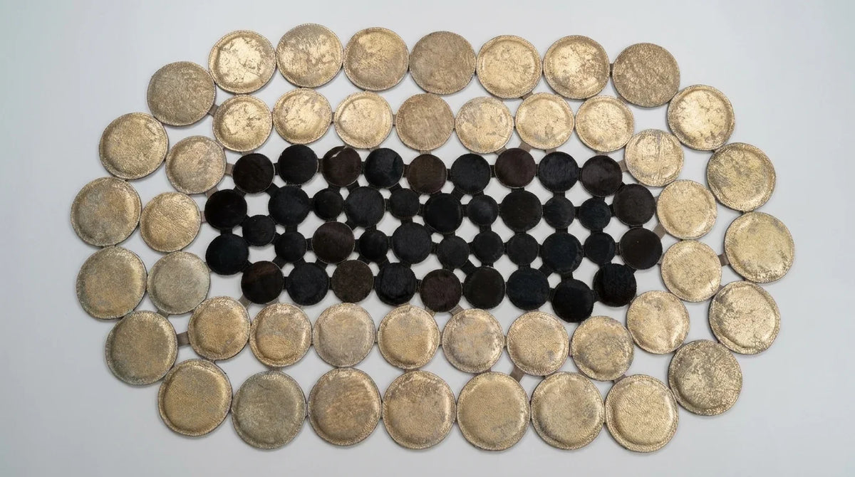 Black and White round cowhide rug flat lay on white background showing round shape