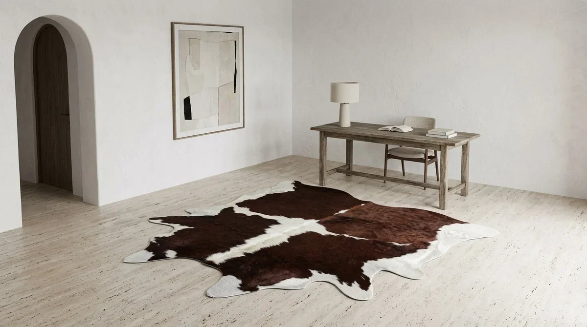 Brown and White cowhide rug under desk in Organic Mediterranean home office