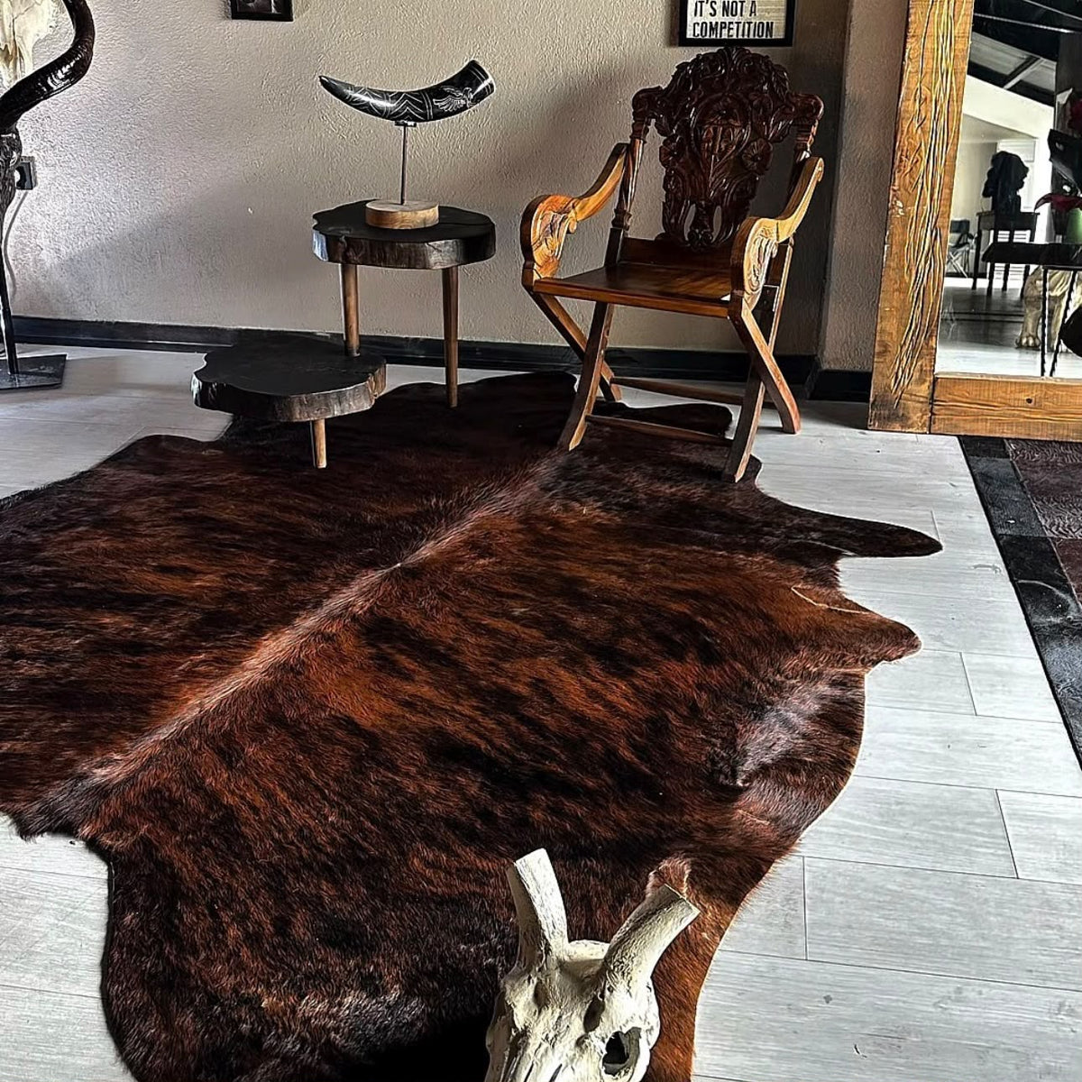 Black and white cowhide rug in a modern living room