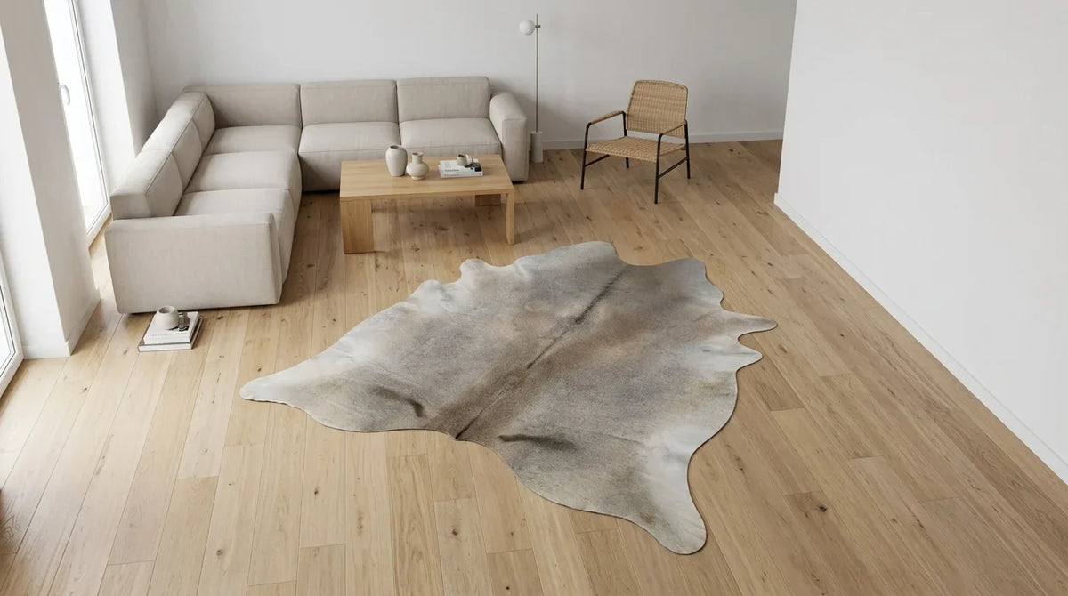Beige cowhide rug on hardwood floor in contemporary european living room