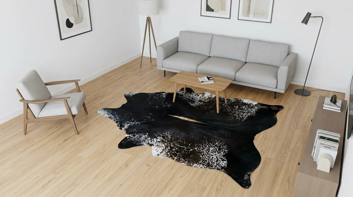 Black and White cowhide rug on hardwood floor in contemporary european living room