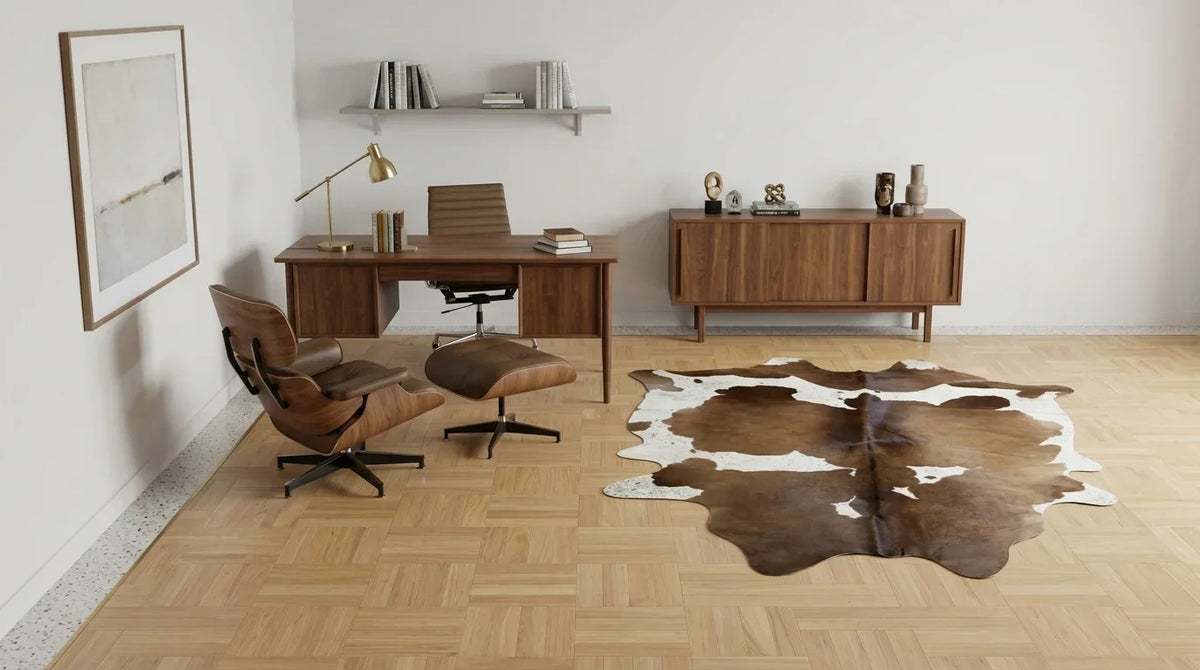 Brown and White cowhide rug under desk in midcentury modern home office