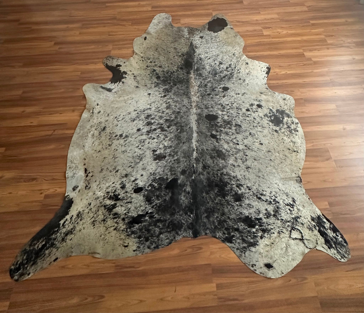 Grey salt and pepper cowhide rug, full overhead view — Fine even speckle of dark and light hairs throughout, peppered appeara