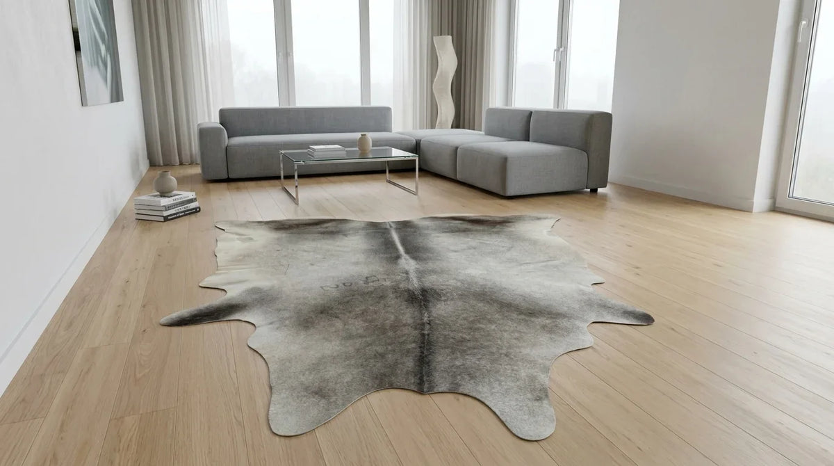 Grey cowhide rug on hardwood floor in contemporary european living room