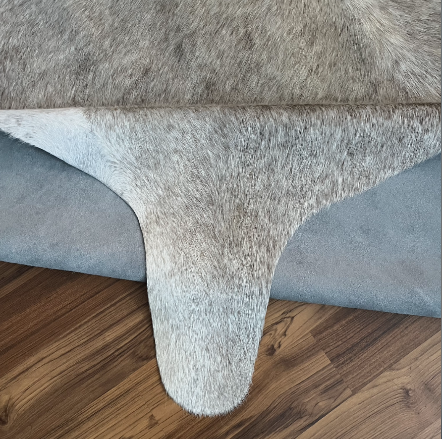 Close-up texture of Grey cowhide rug — Fine salt and pepper texture with natural irregular patches and natural center stripe
